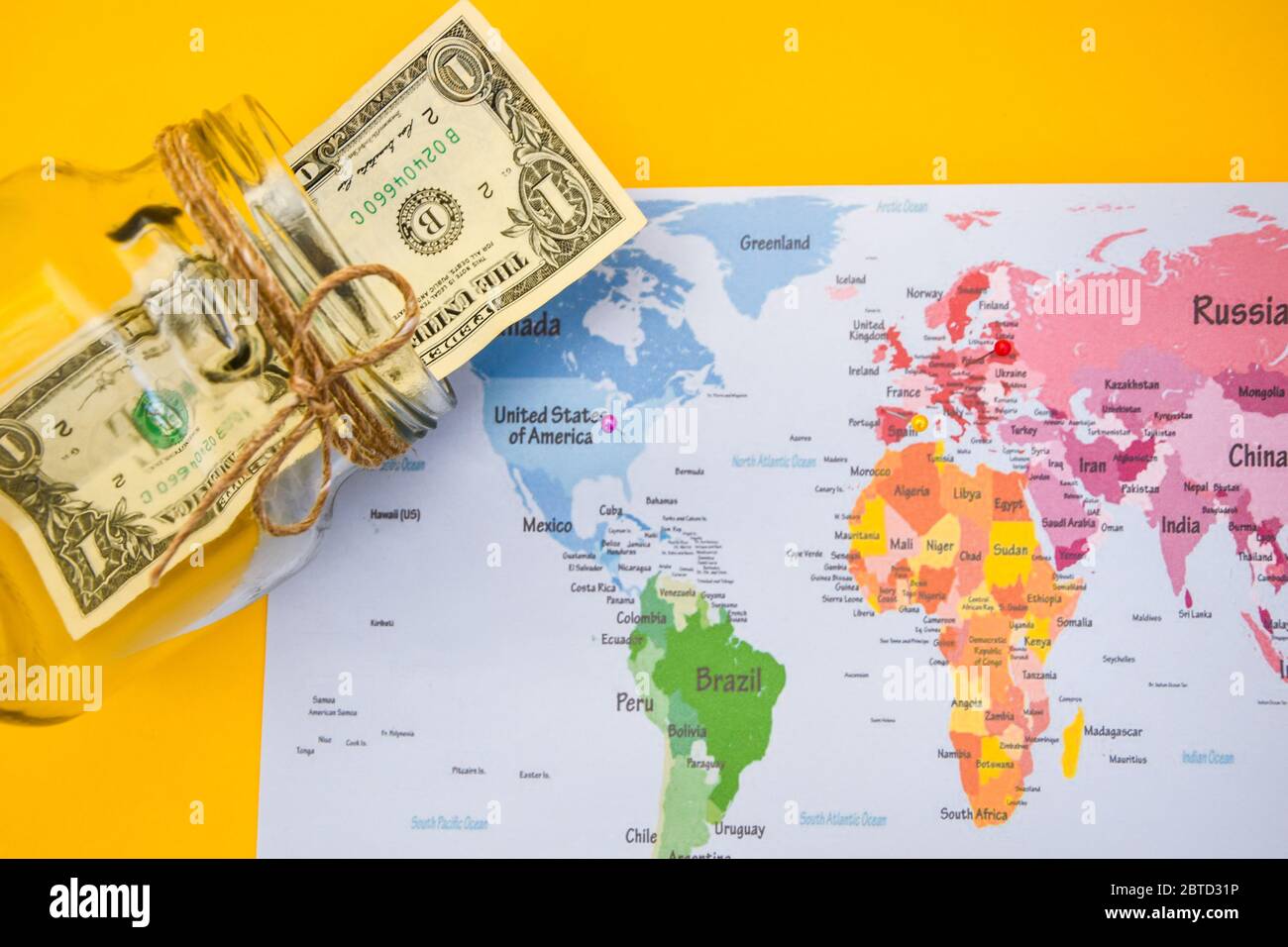 Money Is The Most Important Thing On Planet Earth Us Dollars And World Map Stock Photo Alamy