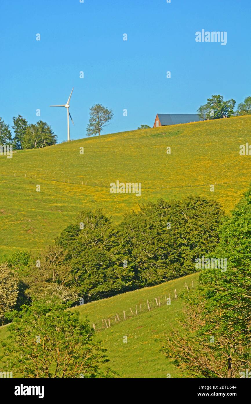 farm and wind turbin, Cezallier plateau, Puy-de-Dome, Auvergne, Massif-Central, France Stock Photo