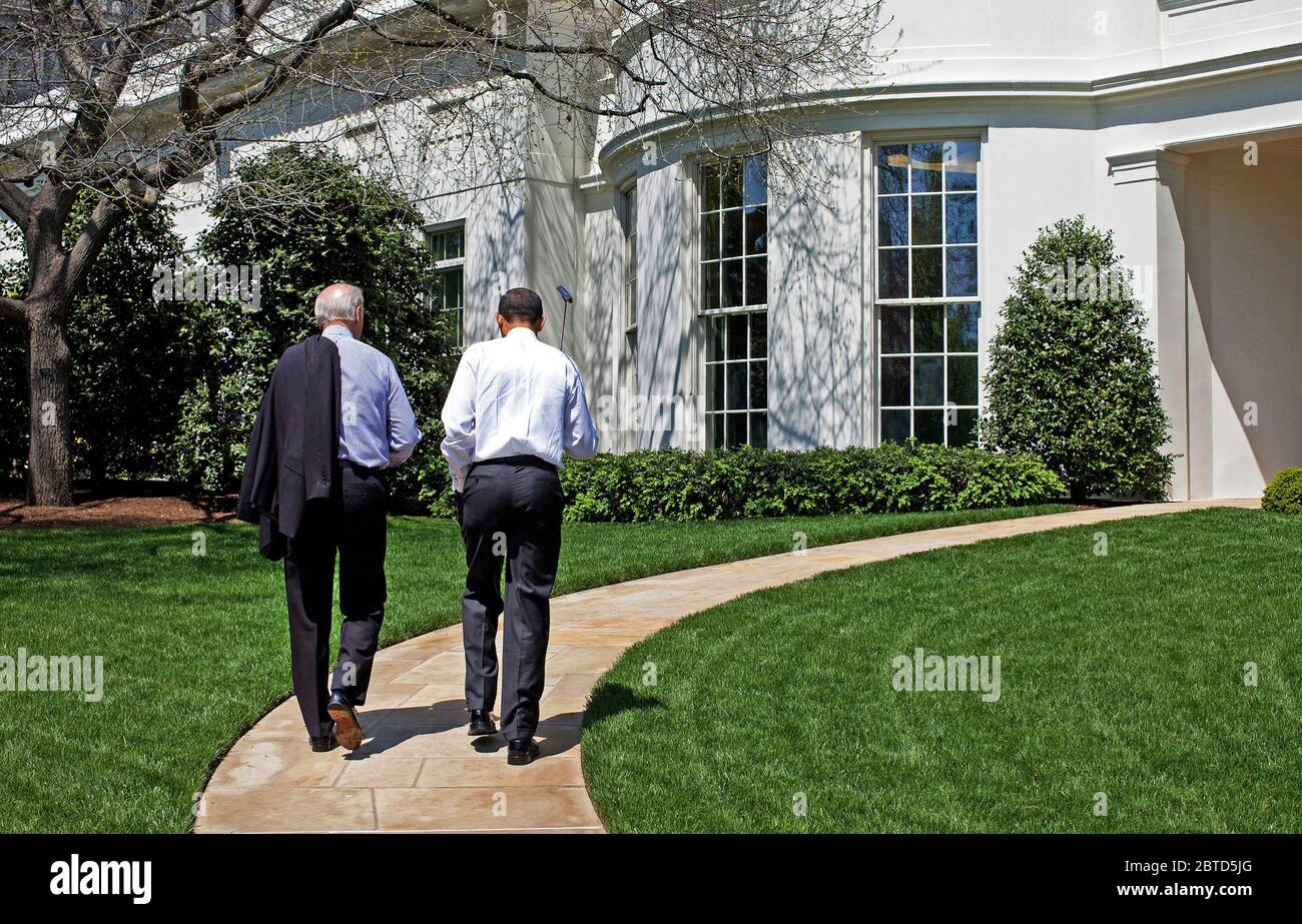 President Barack Obama and Vice President  Joe Biden walk back to the Oval Office after putting on the White House putting green April 24, 2009. Stock Photo