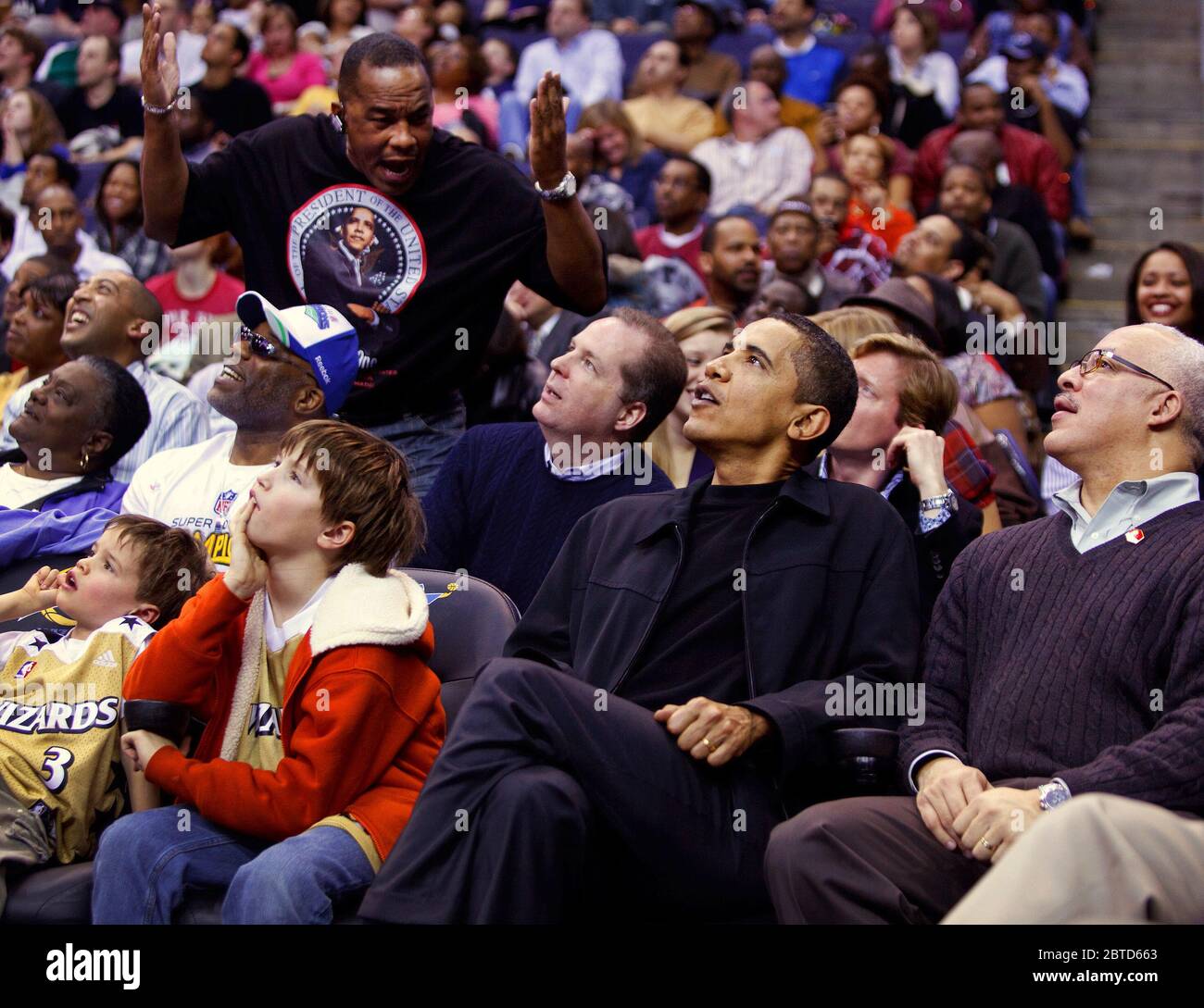 President Barack Obama attends a Washington Wizards vs Chicago Bulls basketball game at the Verizon Center, Washington, D.C 2/27/09. Stock Photo
