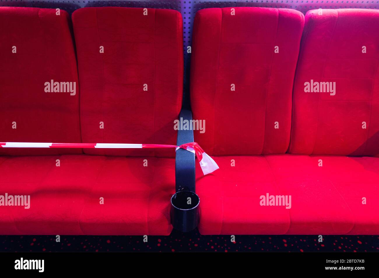 Dresden, Germany. 22nd May, 2020. Cinema seats, as a seat in front of a hall in the cinema Ufa-Kristallpalast in the inner city, are partly blocked off with flutterband. As the first big cinema in the city, the Ufa-Palast was allowed to reopen after the Corona-Lockdown. (to dpa 'With popcorn, without mask: How can a visit to the cinema look like now?') Credit: Robert Michael/dpa-Zentralbild/dpa/Alamy Live News Stock Photo
