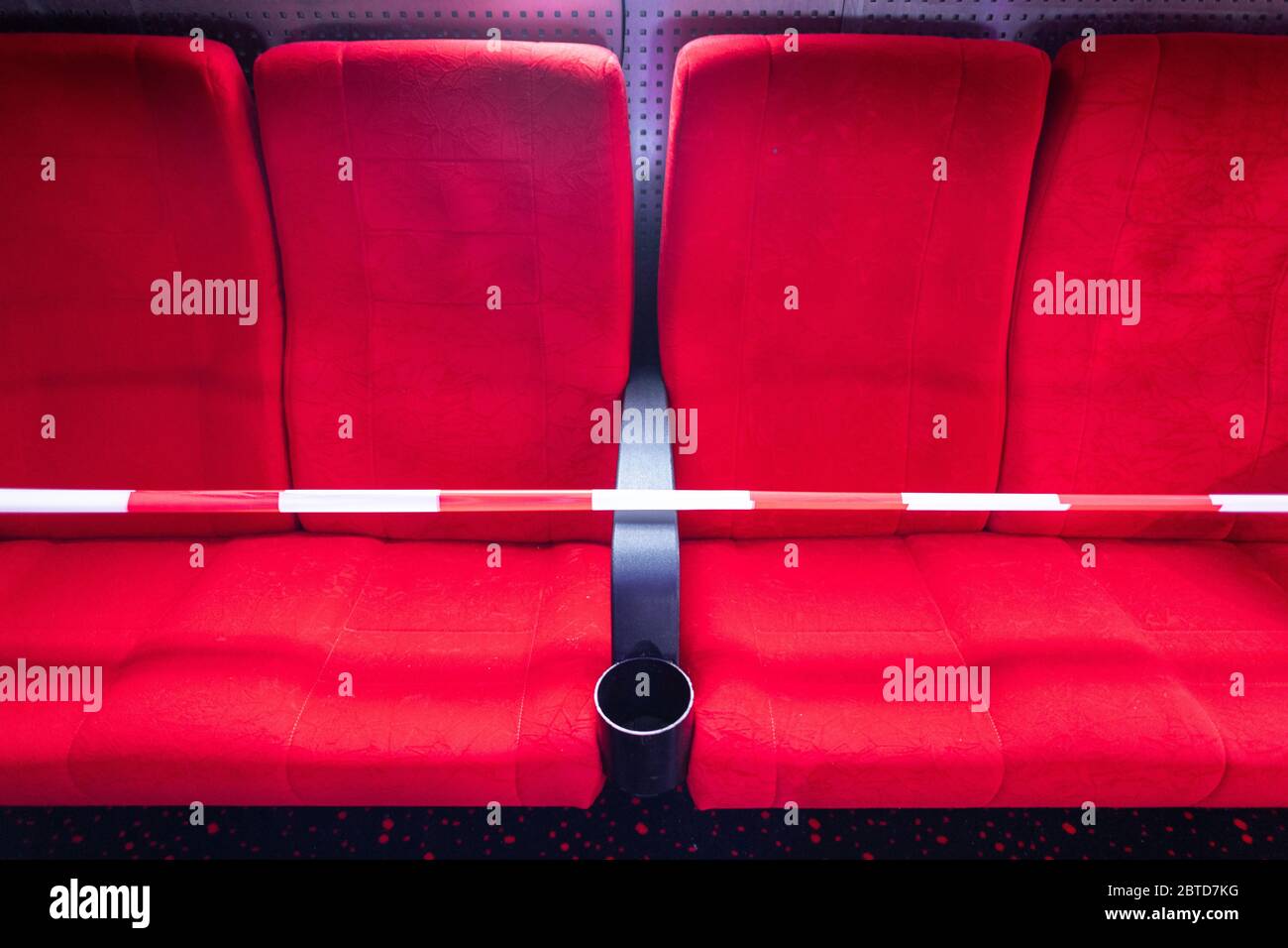 22 May 2020, Saxony, Dresden: Cinema seats, as a seat in front of a hall in the cinema Ufa-Kristallpalast in the inner city, are locked with a flutter band. As the first big cinema in the city, the Ufa-Palast was allowed to reopen after the Corona-Lockdown. (to dpa 'With popcorn, without mask: How can a visit to the cinema look like now?') Photo: Robert Michael/dpa-Zentralbild/dpa Stock Photo