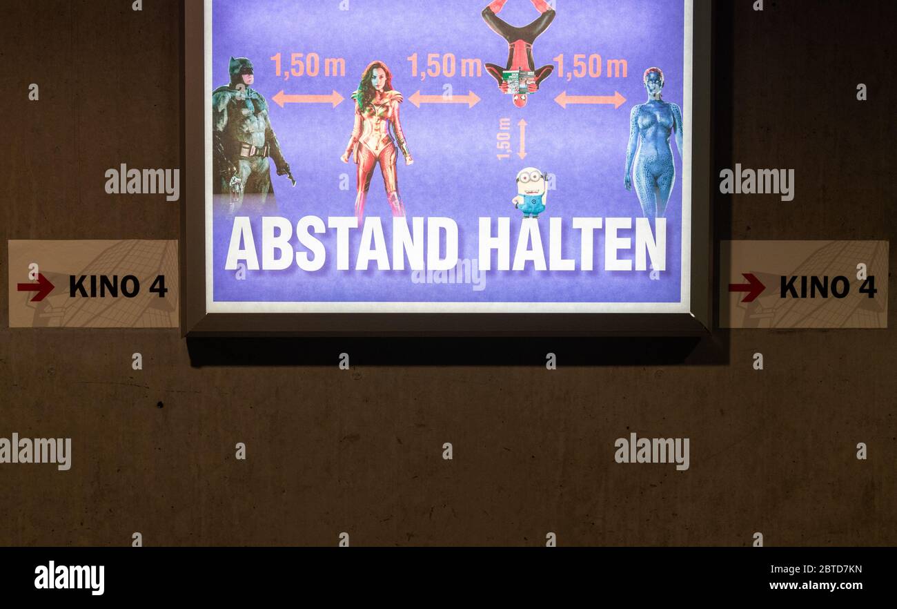 Dresden, Germany. 22nd May, 2020. A poster with a reference to the rules of abstinence hangs in the cinema Ufa-Kristallpalast in the city centre. As the first big cinema in the city the Ufa-Palast was allowed to reopen after the Corona-Lockdown. (to dpa 'With popcorn, without mask: How can a visit to the cinema look like now?') Credit: Robert Michael/dpa-Zentralbild/dpa/Alamy Live News Stock Photo