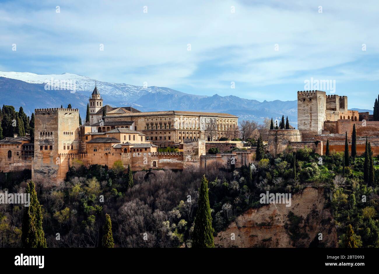 Granada, Andalusia, Spain - Alhambra, Moorish city castle Alhambra, Nasrid palaces, Palace of Charles V, in the back snow-covered Sierra Nevada. Grana Stock Photo