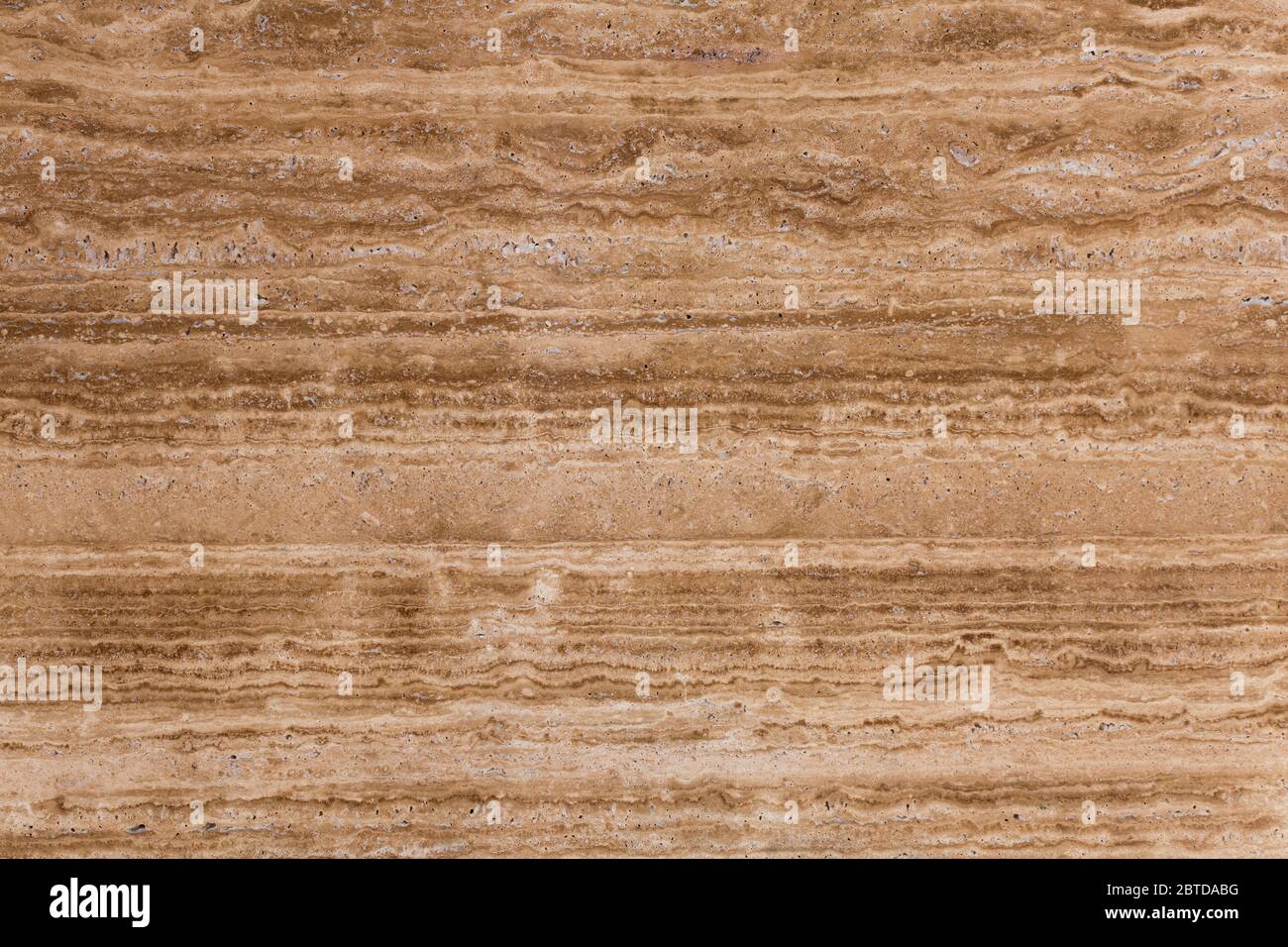 Beige, brown natural travertine stone texture close-up. Stock Photo