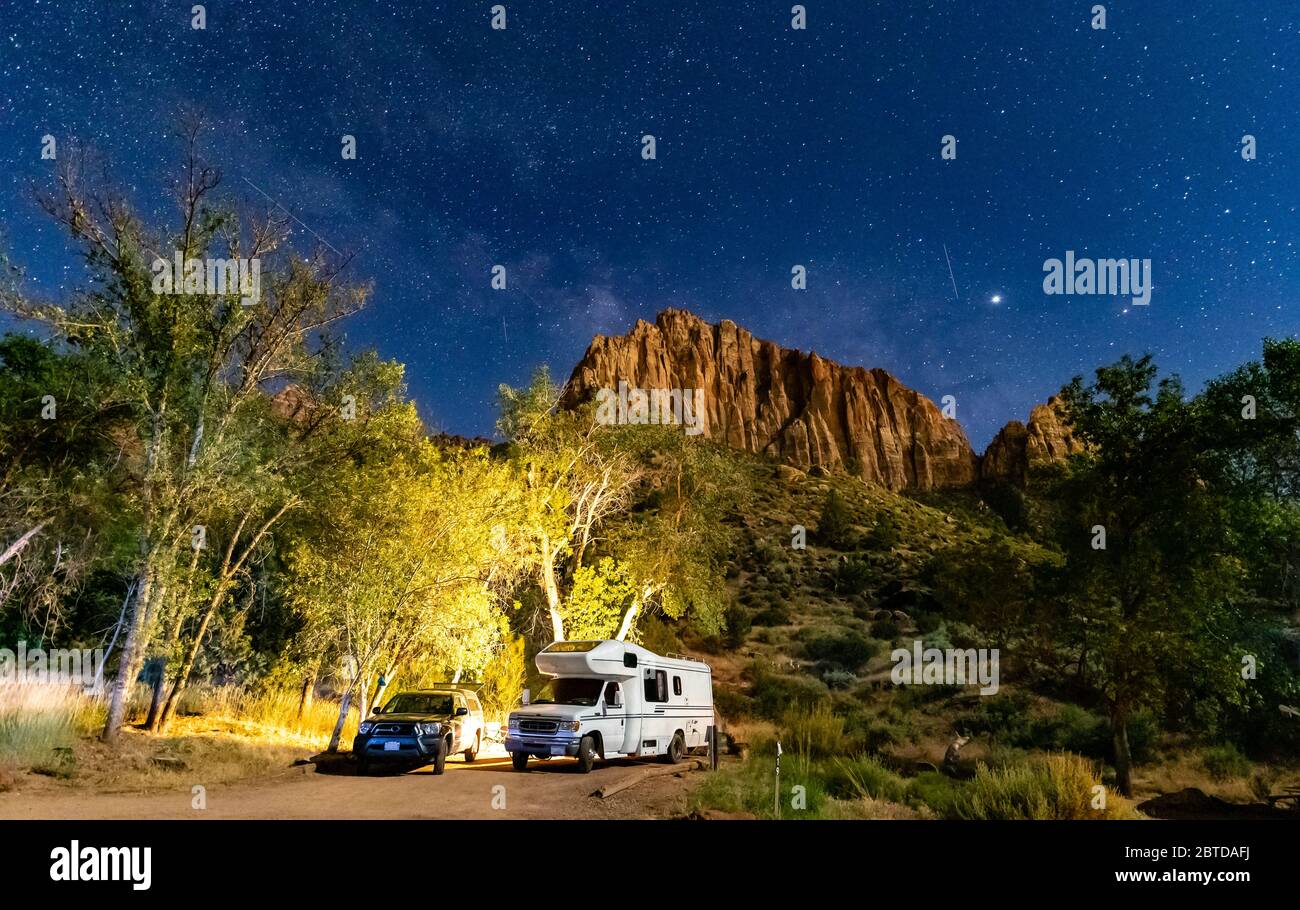 RV Camping under stars at night in Capitol Reef National Park, Utah, USA Stock Photo