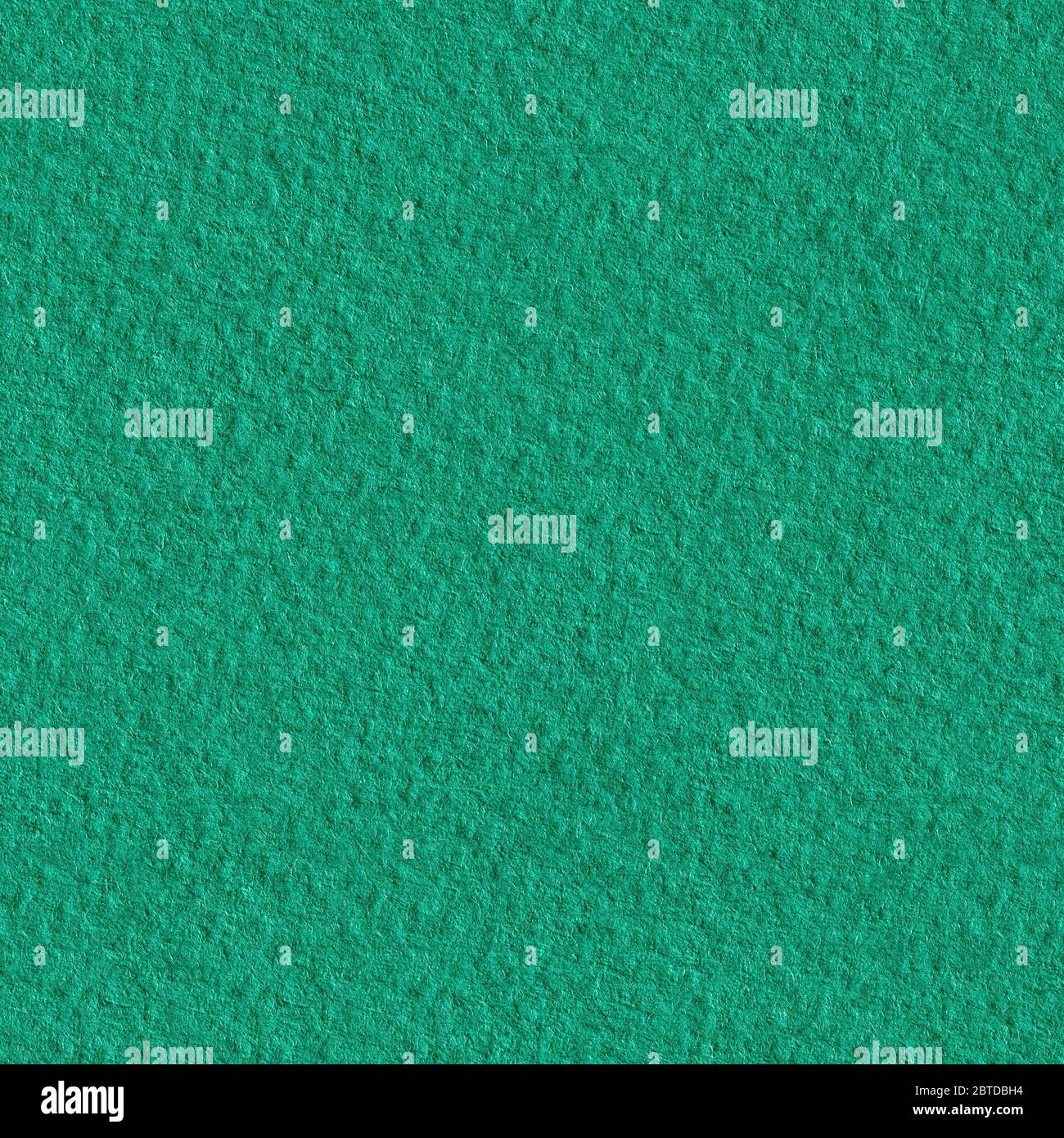 Textured dark green paper as background. Seamless texture. Tile ready. Stock Photo