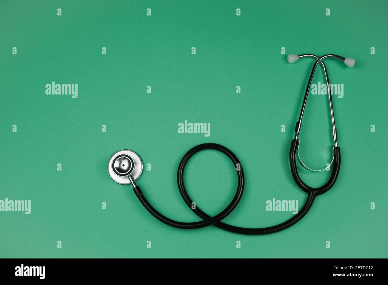 The stethoscope on a green background Stock Photo - Alamy