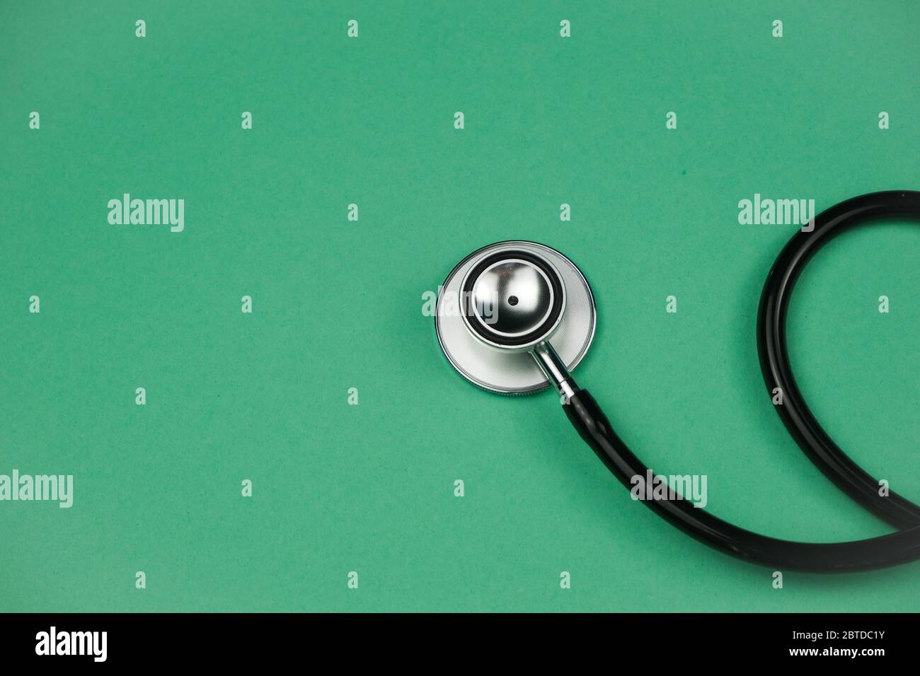 The stethoscope on a green background Stock Photo - Alamy