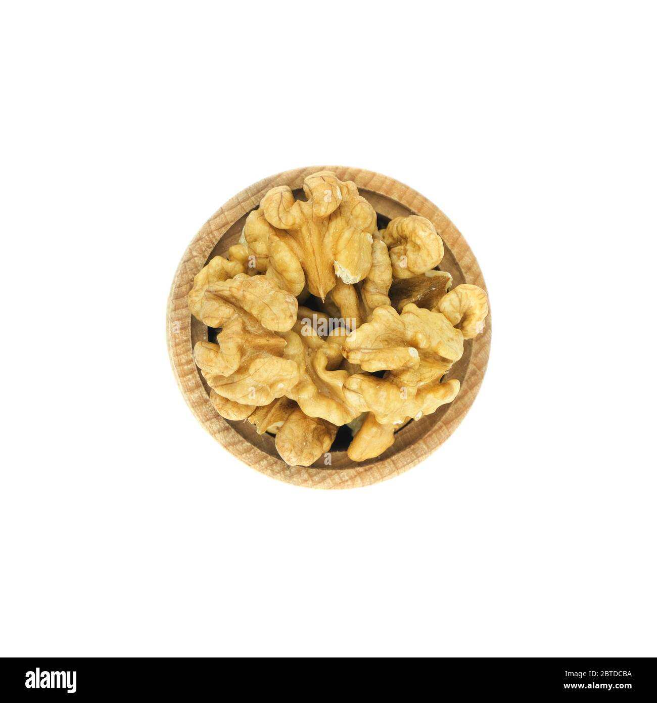 Walnuts in wood bowl close up isolated on white background. Stock Photo