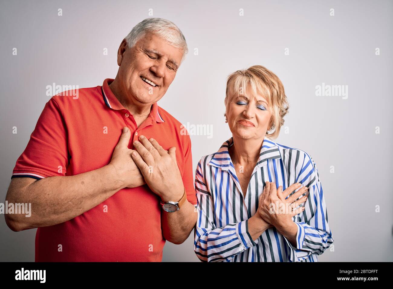Senior beautiful couple standing together over isolated white ...