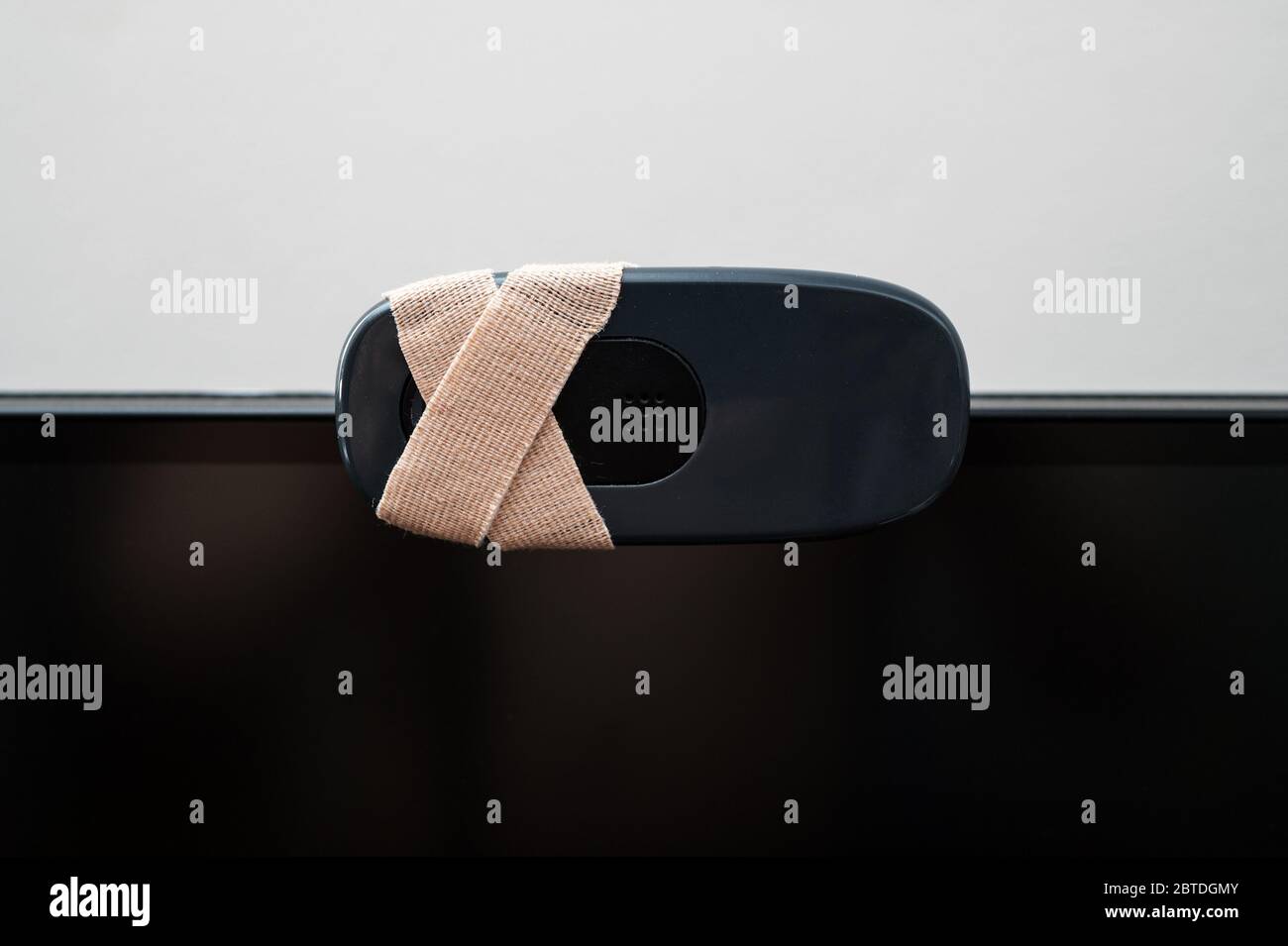 Close-up view of web camera covered with tape. Stock Photo