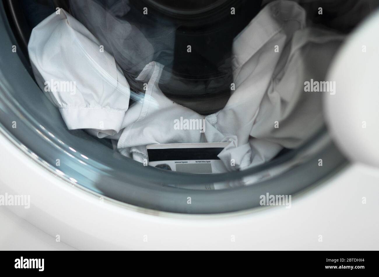 credit card in the washing machine Stock Photo Alamy