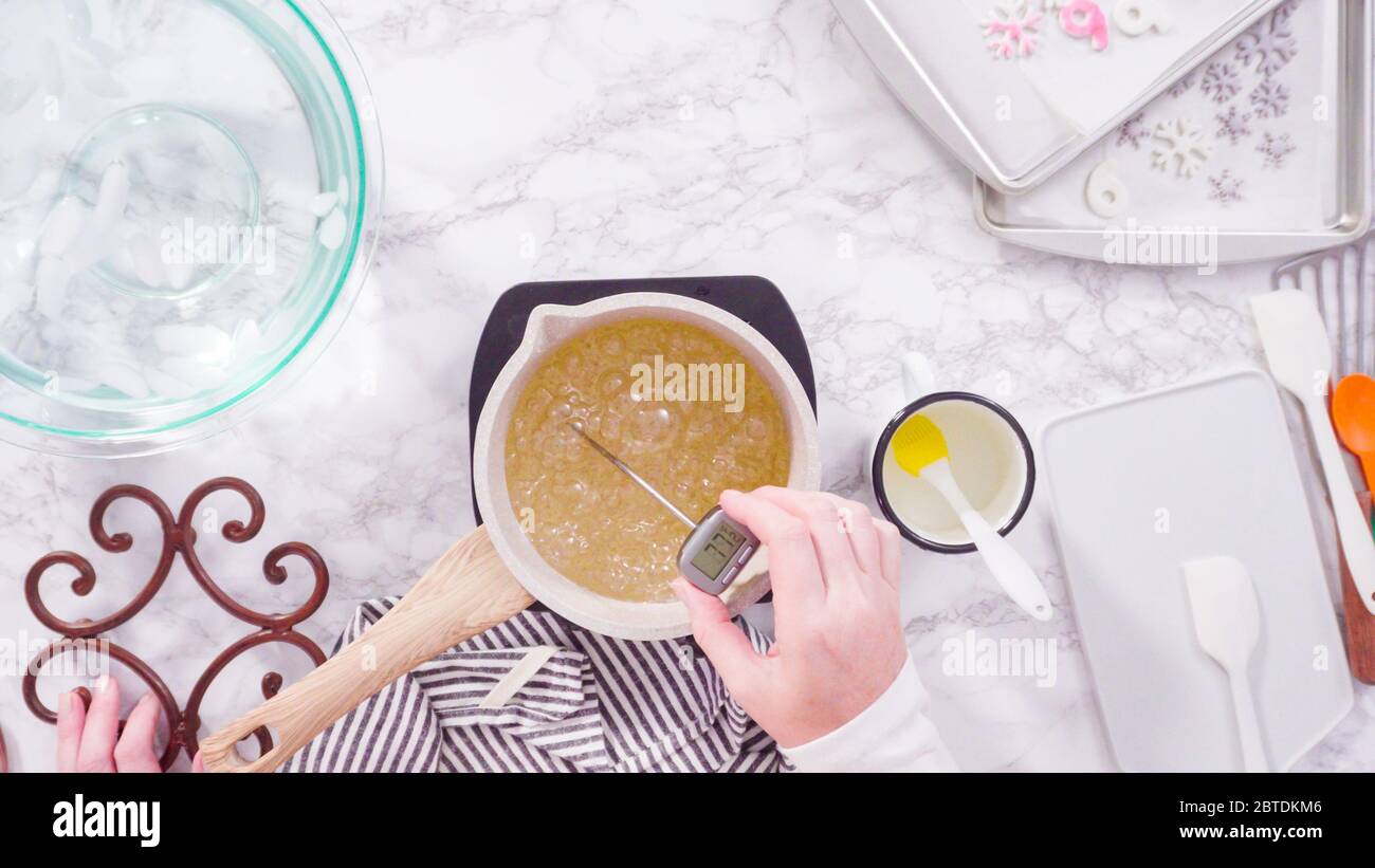 Flat lay. Step by step. Caramelizing sugar in a small cooking pot over ...