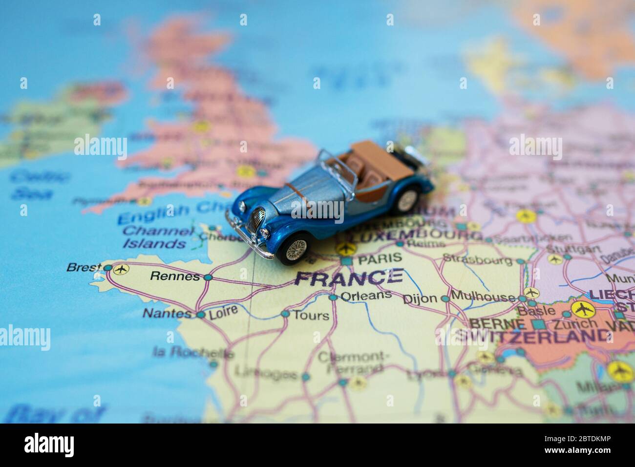 Small toy retro car on Europe map in France. Travel by car concept Stock  Photo - Alamy