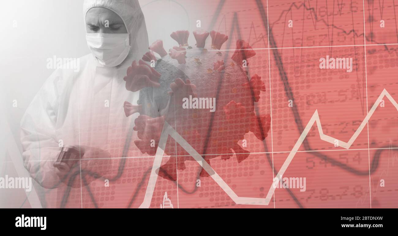 Healthcare worker wearing protective suit over red graphs and coronavirus Covid19 cell Stock Photo