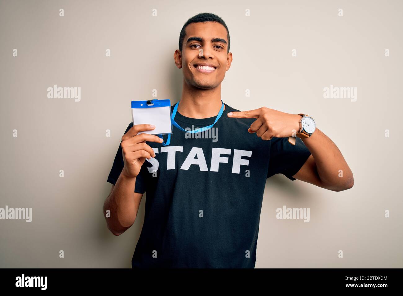 A Man Holding Id Card