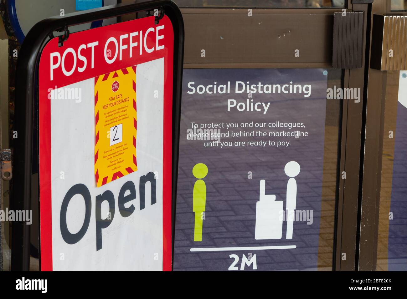 Social Distancing signs in a local Post office window, Fife, Scotland