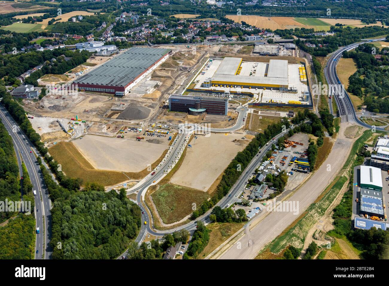 Areal MARK 51░7 with logistics company DHL-Logistik on the area of former OPEL factory I in Bochum, construction site of new motorway A448, 10.04.2019, aerial view, Germany, North Rhine-Westphalia, Ruhr Area, Bochum Stock Photo