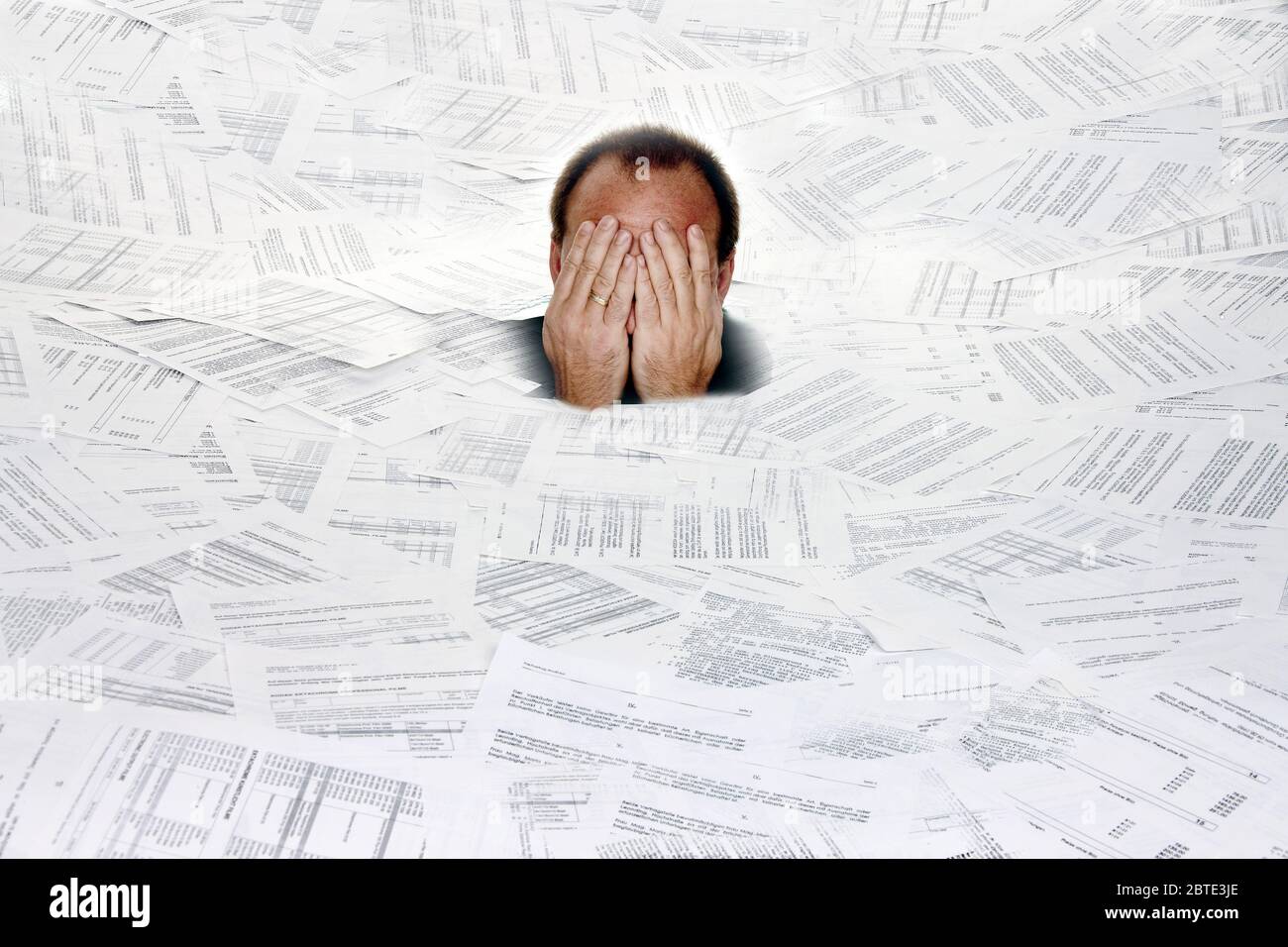 man between documents, too much bureaucracy, Austria Stock Photo