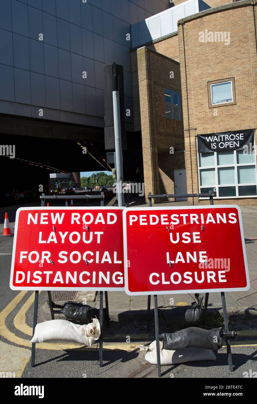 new road layout for social distancing and pedestrians use lane closure signs in kingstong, surrey, england, due to covid 19 virus guidelines Stock Photo