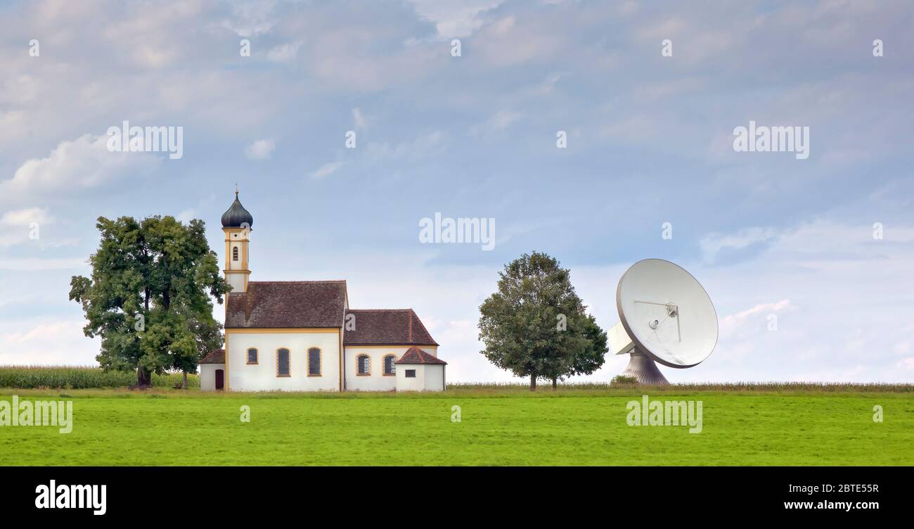church with satellite dish, Ground Sending Plant Raisting, Germany, Bavaria Stock Photo