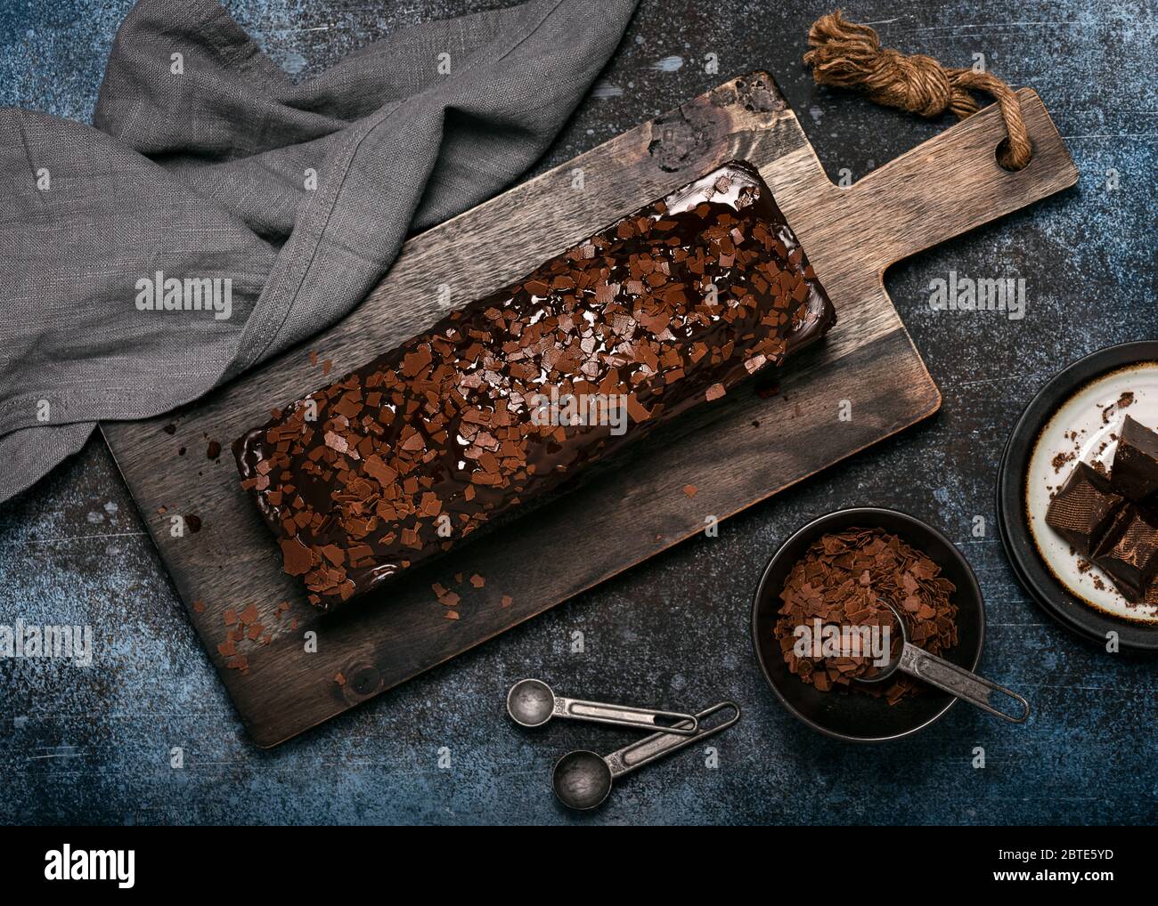 Homemade chocolate loaf cake with chocolate chips topping and glaze on