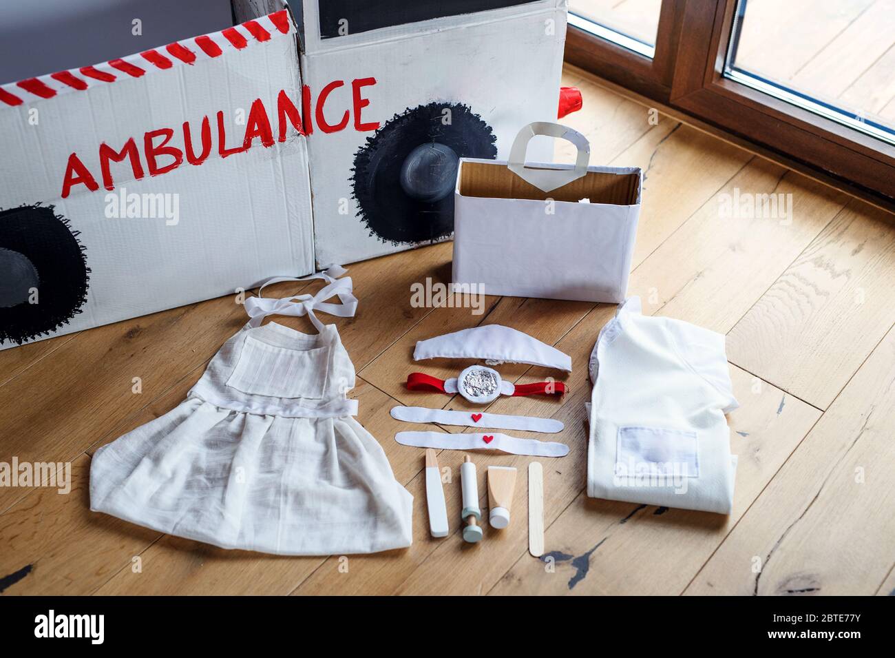 Composition of diy doctor toys for children on wooden background. Stock Photo