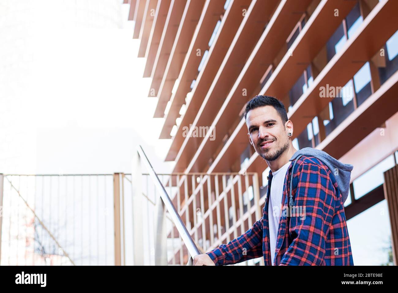 Portrait of smiling stubble male at outdoors Stock Photo
