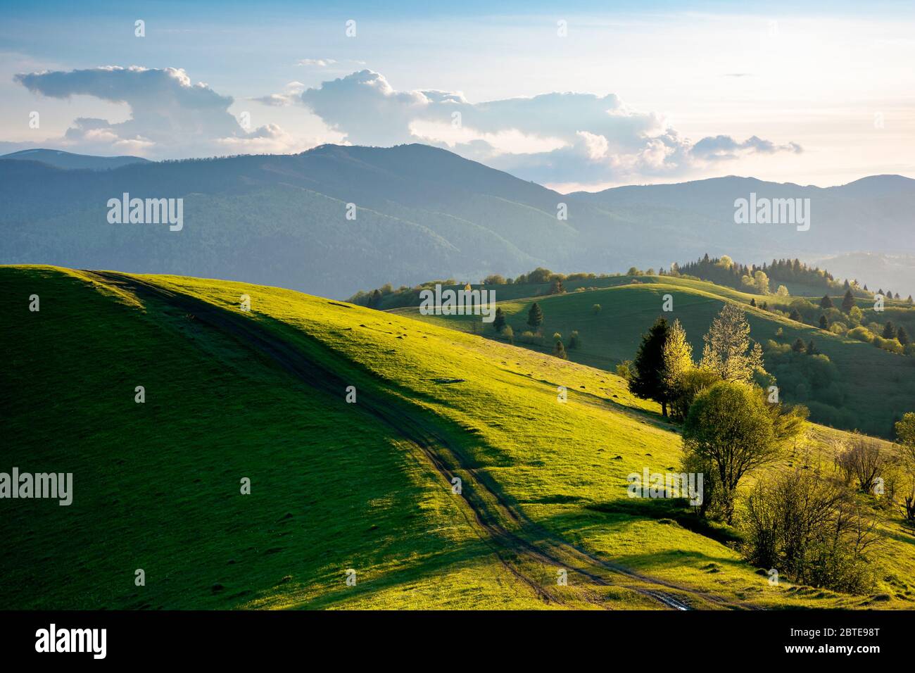Path Through Countryside Fields Beautiful View Of Rural Landscape At Sunset Hills Rolling Down In To The Distant Valley Clouds On The Blue Sky In E Stock Photo Alamy Path Through Countryside Fields Beautiful View Of Rural Landscape At Sunset Hills Rolling Down In To The Distant Valley Clouds On The Blue Sky In E Stock Photo Alamy