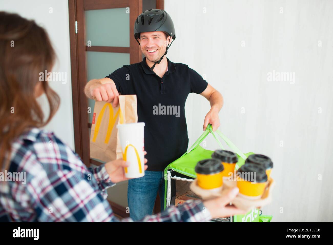 Kyiv, Ukraine - May 06, 2020: An Uber Eats courier. Food delivery 