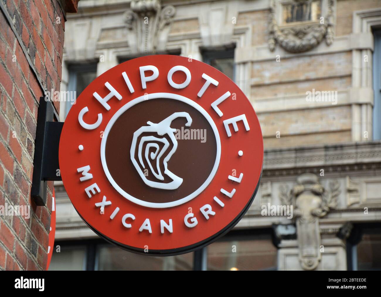 BOSTON, USA - OCTOBER 21, 2014 :  Chipotle Mexican Grill signboard on the wall in Boston. Chipotle is a chain of American restaurants serving mexican Stock Photo