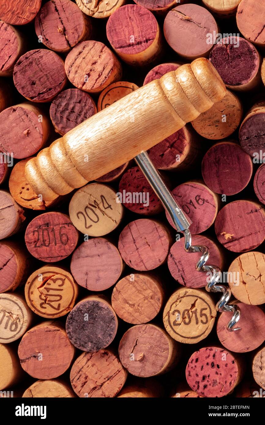 Wine corks with a vintage corkscrew, shot from above Stock Photo