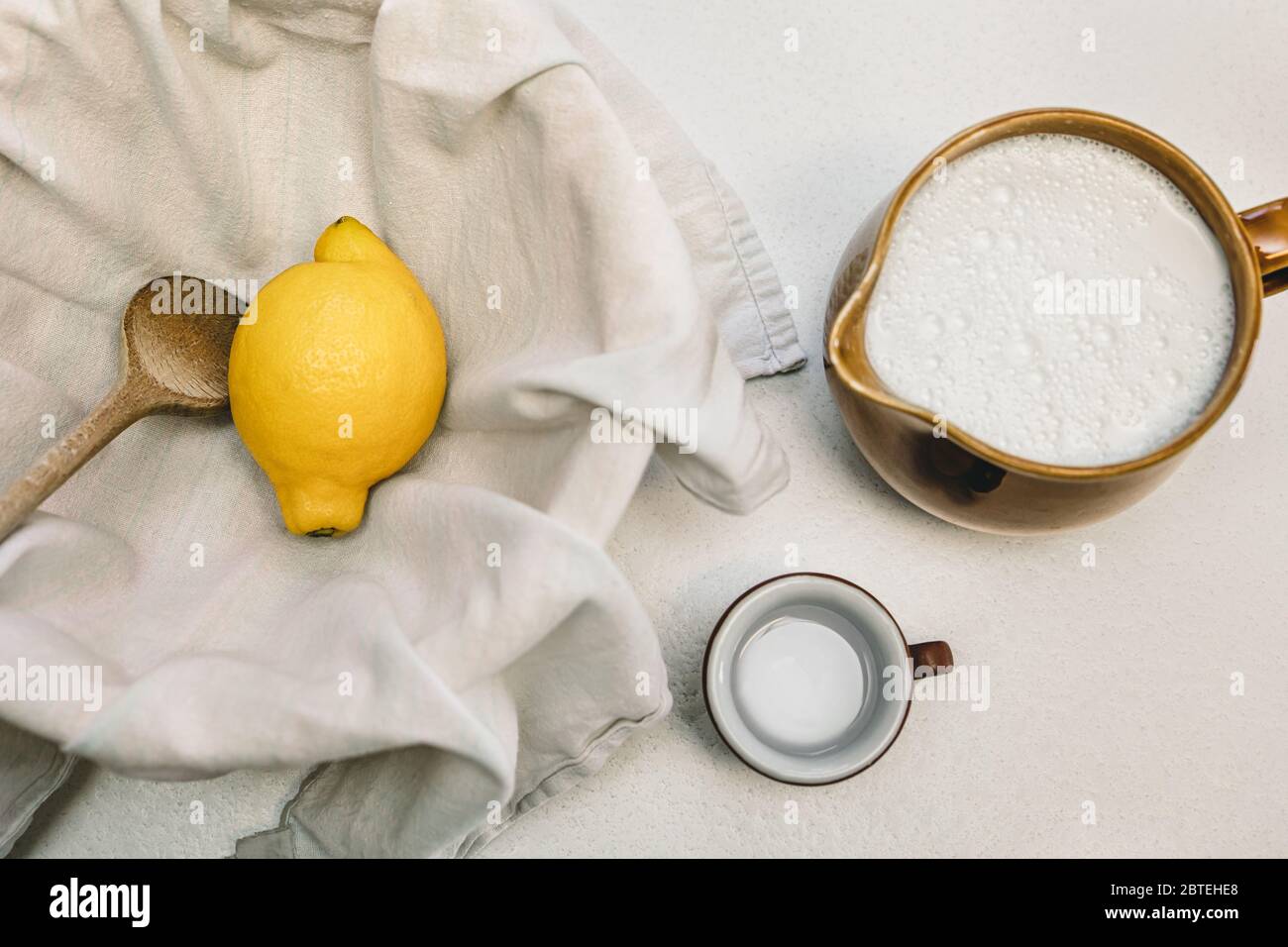 Flatlay, cheese making recipe ingredients, milk, lemon and a cotton cloth, fresh cottage and paneer Stock Photo