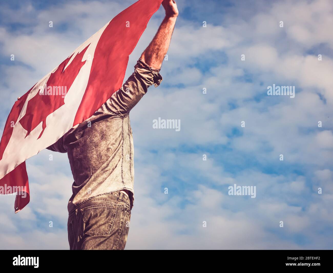 Attractive man holding Canadian Flag. National holiday Stock Photo - Alamy