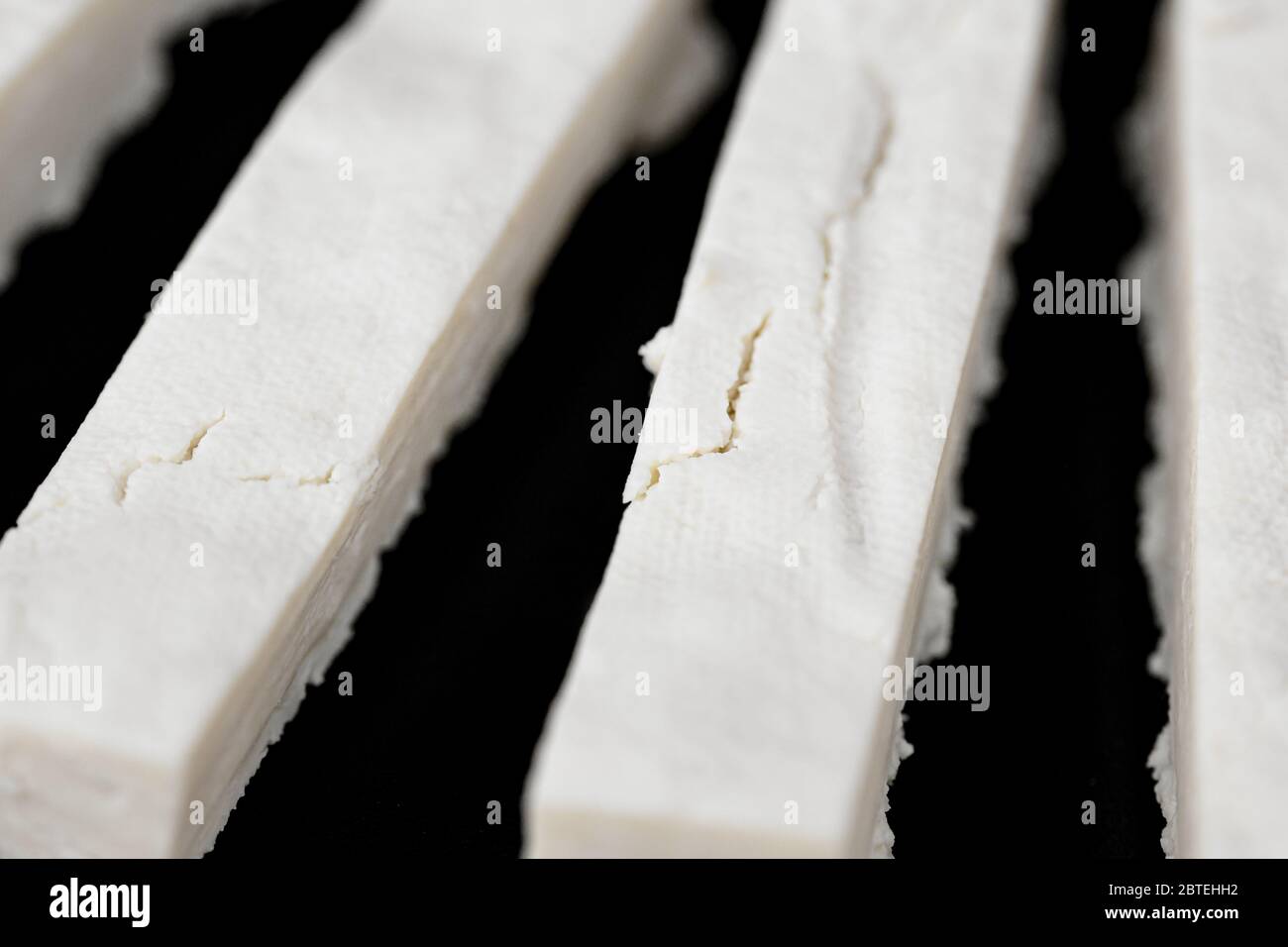 Fresh cheese making process, closeup of homemade cottage cheese or