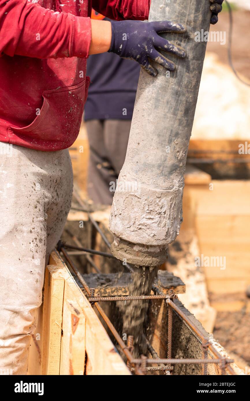 Close Up Of Construction Worker Laying Cement Or Concrete Into The ...