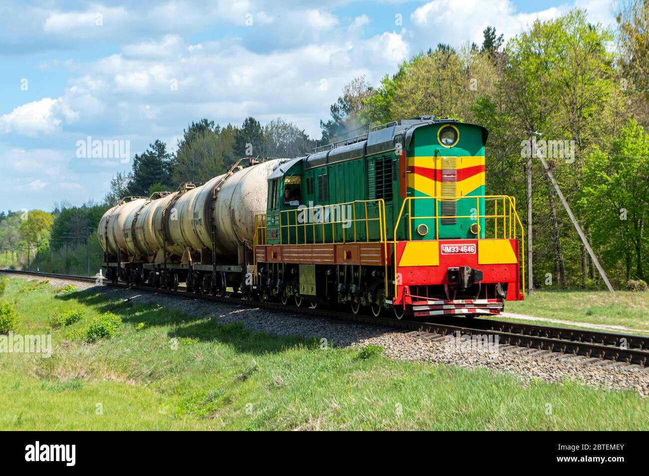 Freight diesel locomotive close view. Oil delivery. Oil shipping train. Green locomotive. freight train oil shipment. Stock Photo
