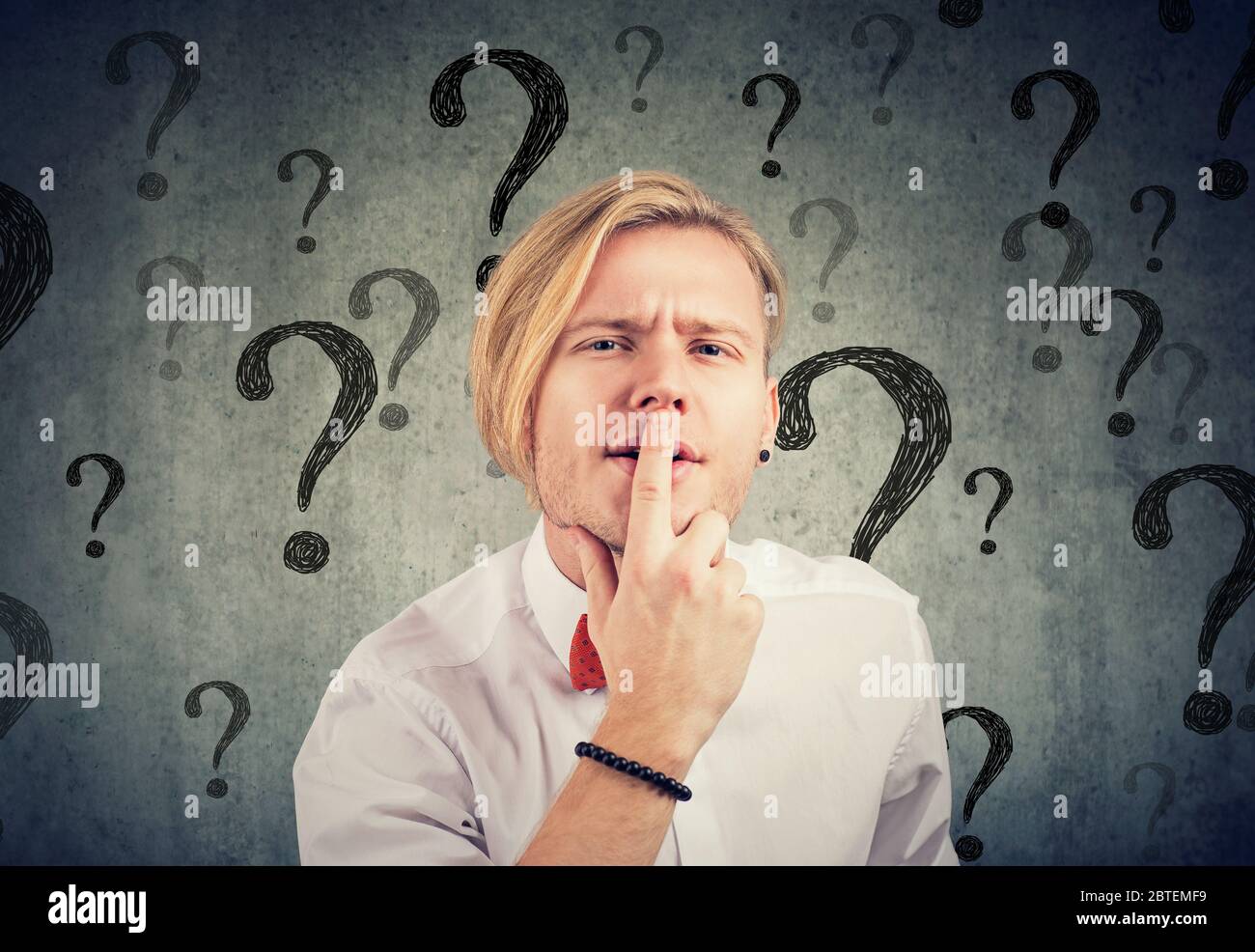 Confused young man with too many questions and no answer Stock Photo