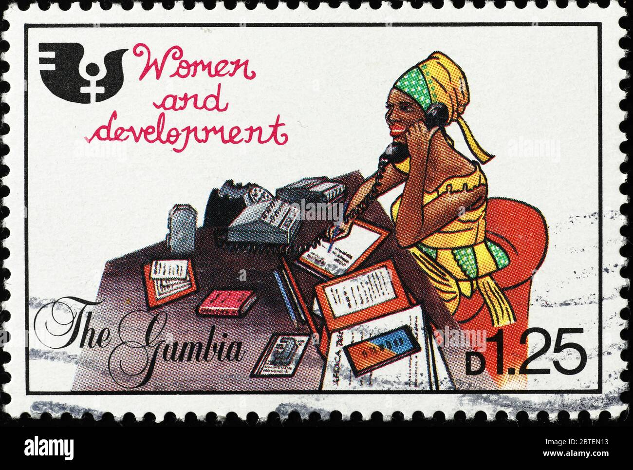 African woman working at a desk as office worker on stamp Stock Photo