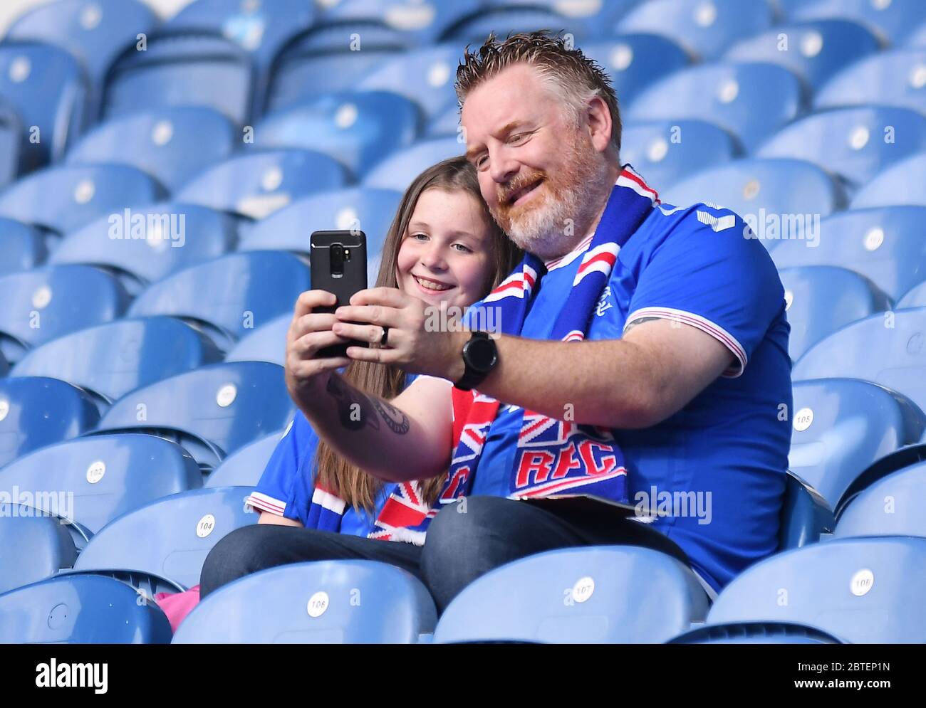GLASGOW, SCOTLAND - JULY 18, 2019: A Rangers fans familypictured prior to the 2nd leg of the 2019/20 UEFA Europa League First Qualifying Round game between Rangers FC (Scotland) and St Joseph's FC (Gibraltar) at Ibrox Park. Stock Photo