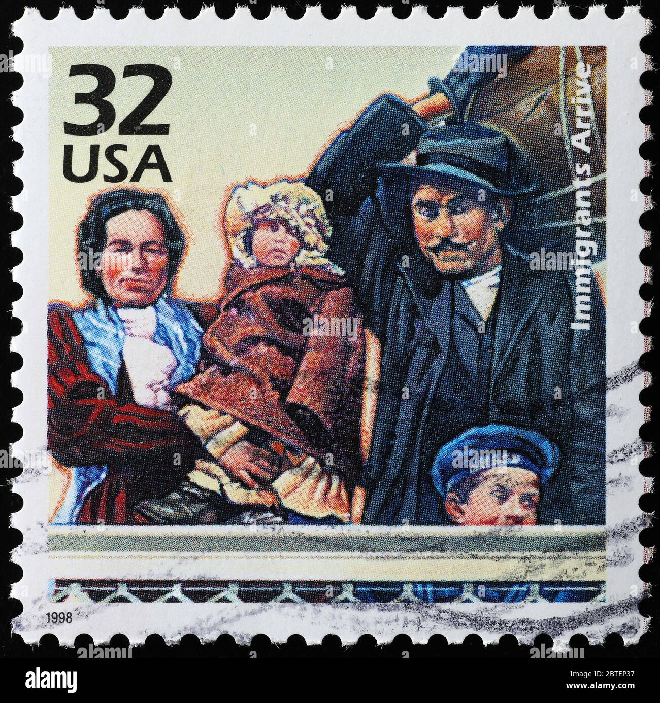 Immigrants arriving to Ellis island in on american stamp Stock