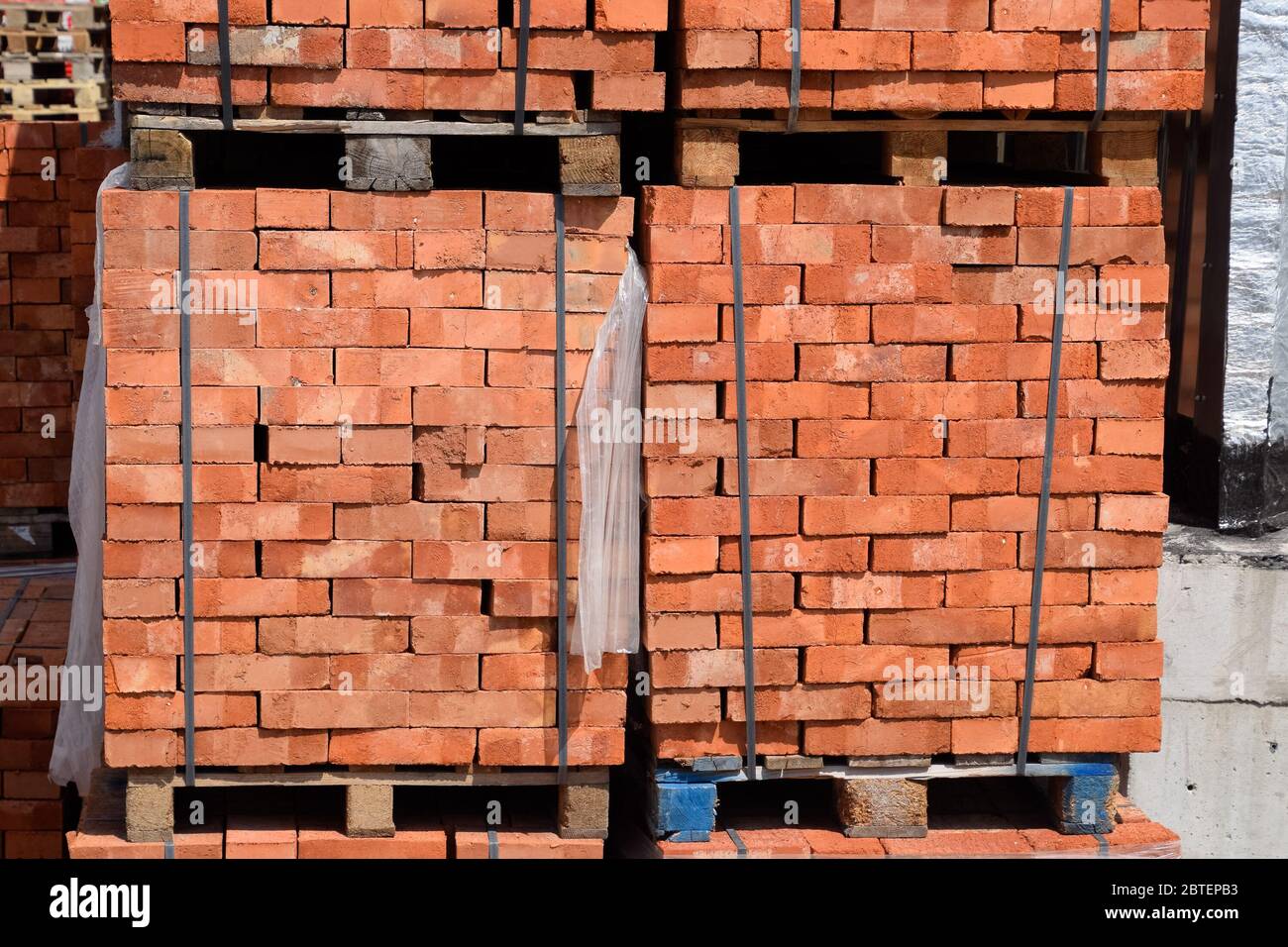 Bricks on pallets. Storage of bricks at the construction site Stock