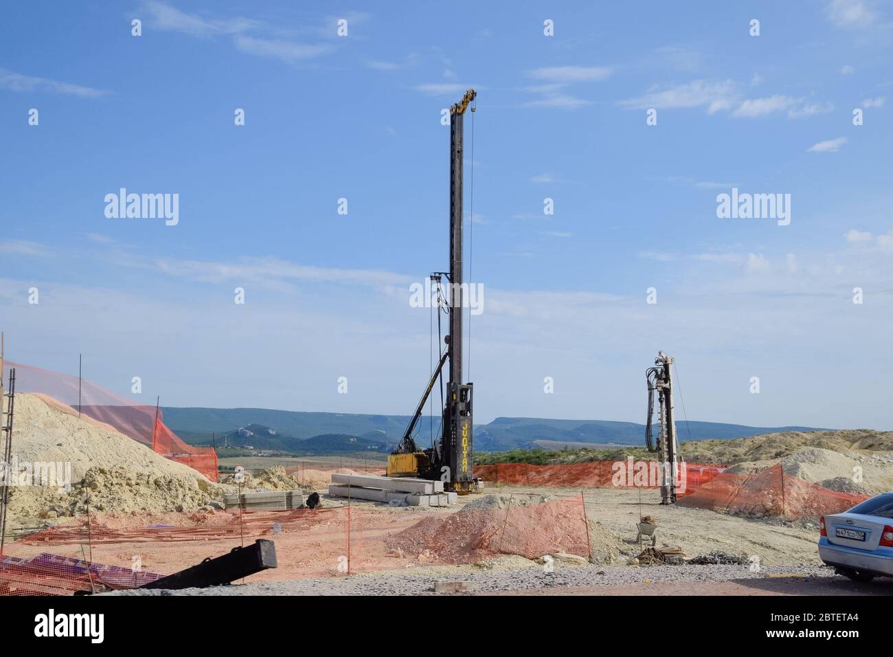 Construction of a new road and transport interchange. Work on reinforced concrete structures and road surface. Stock Photo