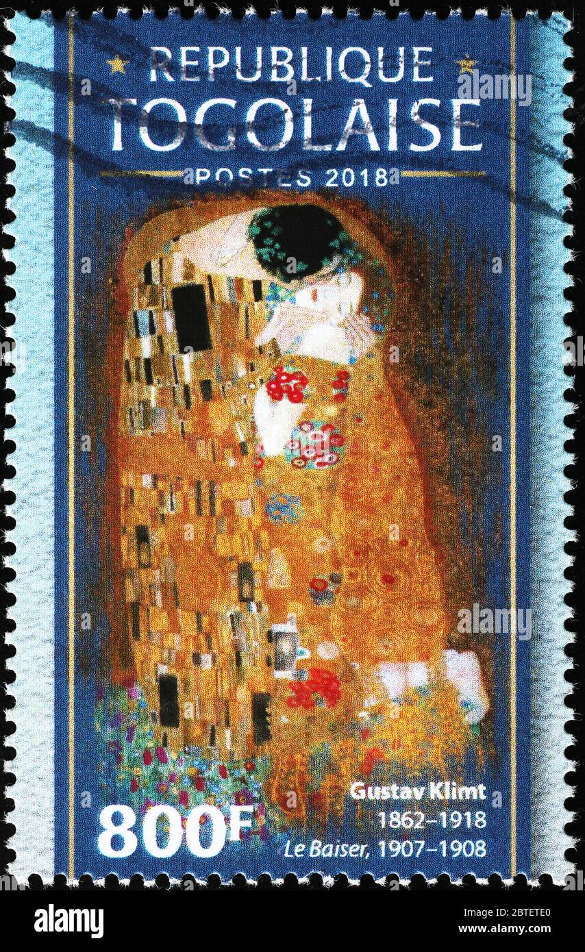 The kiss by Gustav Klimt on postage stamp of Togo Stock Photo