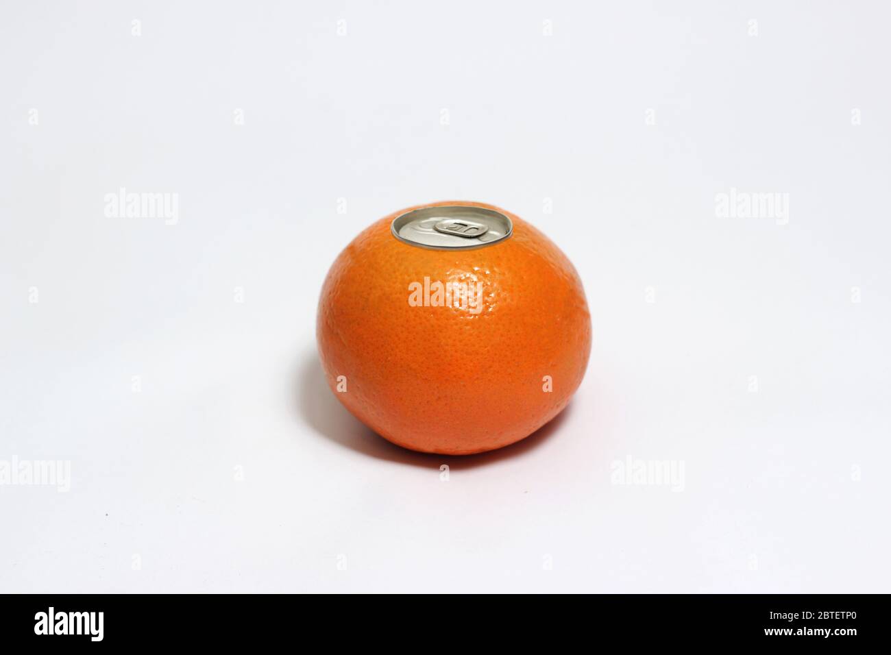 Fresh orange with pop up silver top of a can isolated on white background. Stock Photo