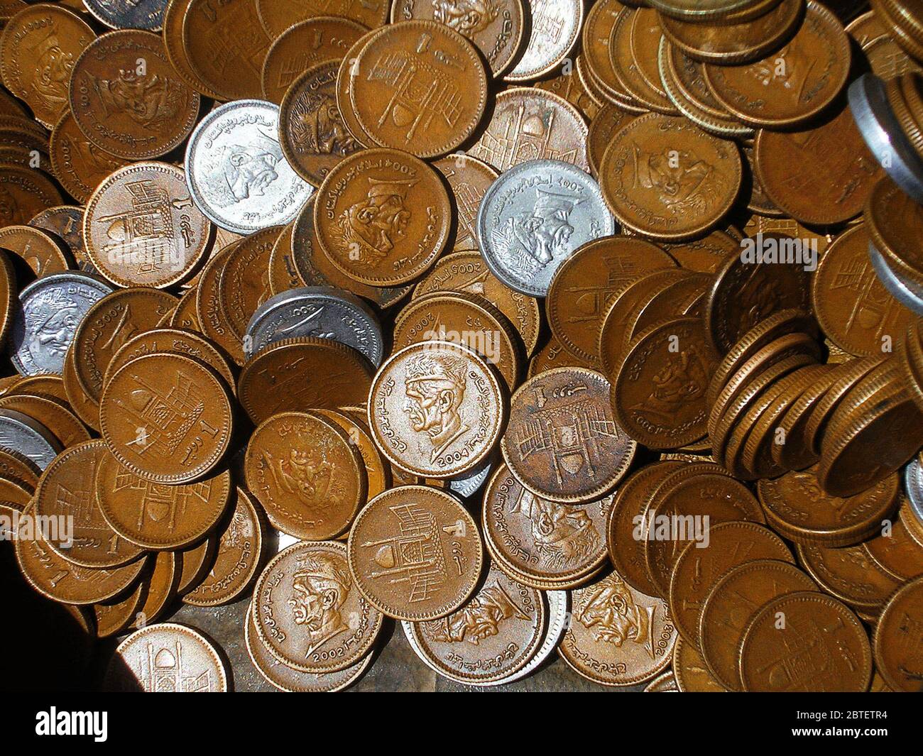 Pakistani Currency - Picture Full Of Metal one rupee Coins including new and old coins Stock Photo