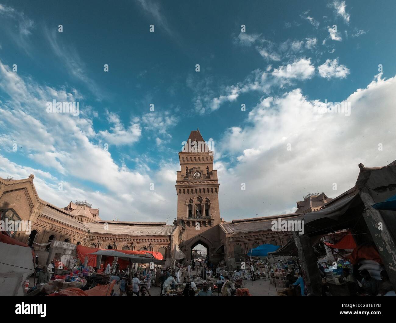 People Selling Different Things In The Beautiful Architecture Of