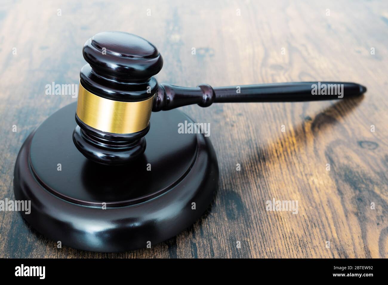 close-up of judges gavel or auction hammer on wooden table Stock Photo
