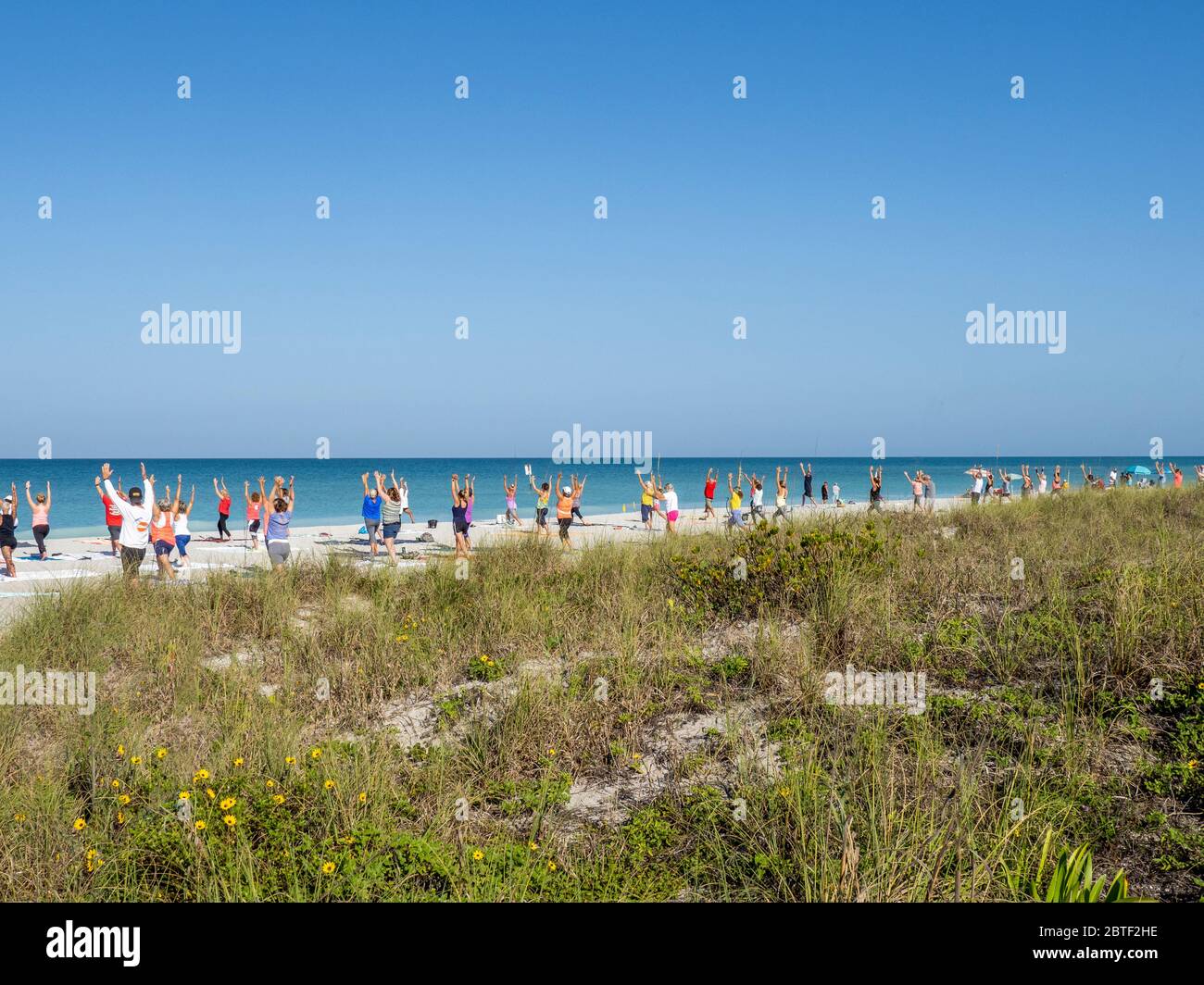 Morning Yoga on Englewood Beach on Manasota Key on the Gulf of Mexico in Englewood FLorida in the United States Stock Photo